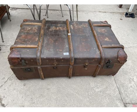 A BOUND COMPRESSED FIBRE TRUNK WITH CANADIAN PACIFIC (GLASGOW) LABEL 