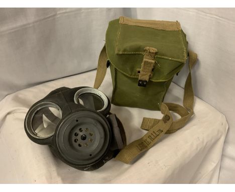 A WW2 1944 DATED GAS MASK IN CASE 