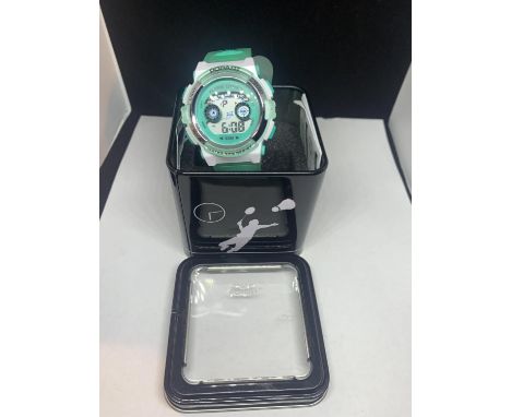 A POP ART DIGITAL WRISTWATCH IN WORKING ORDER WITH PRESENTATION TIN 