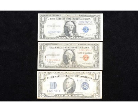A collection of three United States banknotes, including a 1935 'A' series $1 note, I good condition, crisp and flat, one or 