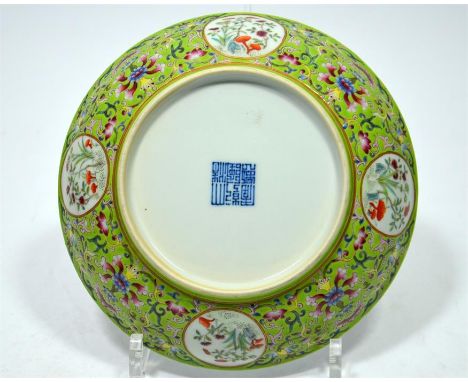 A Chinese porcelain dish, painted with bats around a Shou symbol. The reverse enamelled with lotus scroll and panels of flowe