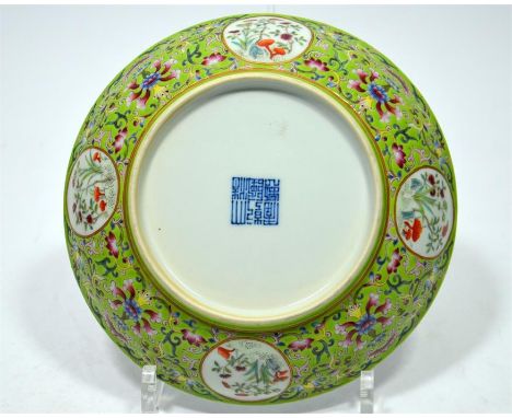 A Chinese porcelain dish, painted with bats around a Shou symbol. The reverse enamelled with lotus scroll and panels of flowe