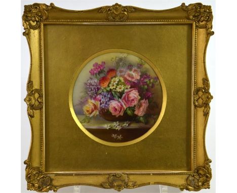 A Royal Worcester circular plaque, decorated with a basket of summer flowers, circa 1911. Signed E. Phillips, glazed and fram