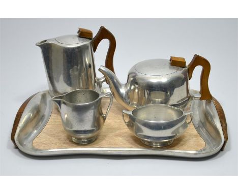 A Piquot ware five piece tea service, includes a teapot, coffee pot, milk jug, sugar pot with a tray. Impressed marks. (5)