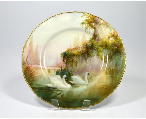 A Royal Worcester cabinet plate, decorated with swans, signed W. Sedgley and date code for 1916. Diameter 26.5cm.