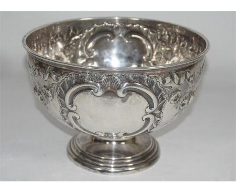 An Edwardian silver rose bowl by Walker and Hall, Sheffield 1903. Embossed decoration. Approx 350 grams. Height 13cm, width 1