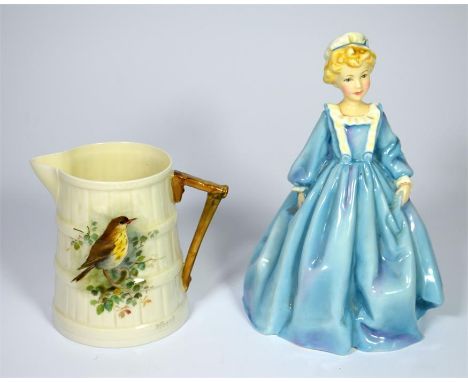 A Royal Worcester jug and figure. Royal Worcester tapering jug decorated with a thrush and angled handle, signed by W Powell,