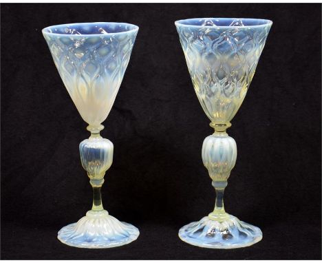 A pair of straw opal/vaseline drinking glasses, circa 1900. Height 19cm (2)