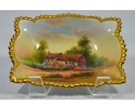 A Royal Worcester pin tray, titled Anne Hathaways Cottage, signed R. Rushton and date code for 1929. Length 13.5cm.