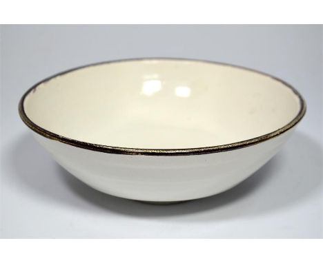 † A Lucie Rie bowl, with gloss white glaze and a manganese rim. Lucie Rie seal. Diameter 15cm, Height 5cm.