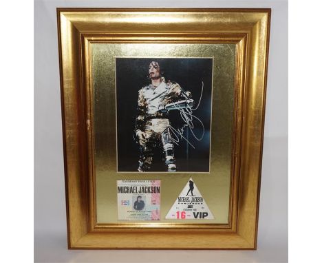 A Michael Jackson autographed photograph, with clear artist's signature. Certificate of authenticity to rear. Photo size 20cm