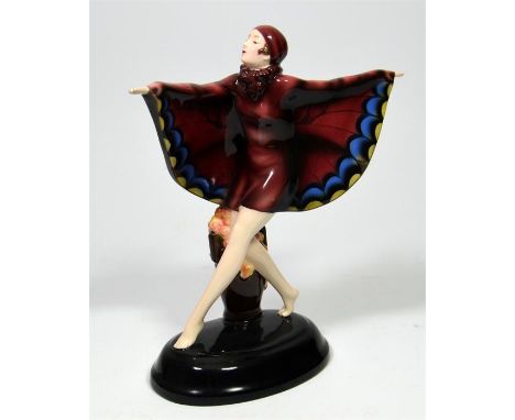 A Goldscheider 'The Captured Bird', a woman with outstretched arms forming purple butterfly wings, designed by Josef Lorenzl.