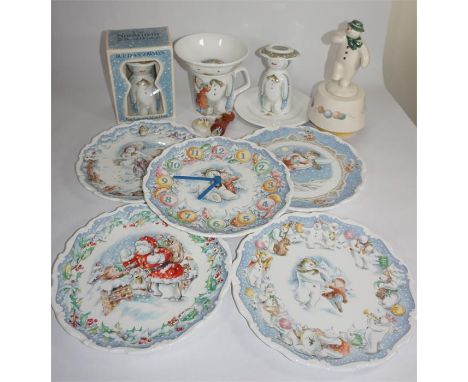 A collection of Royal Doulton 'Snowman' china, including a wall clock, music box, plates and egg cups. Also, figure of 'James