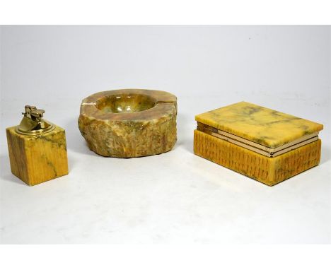 A selection of alabaster items including a cigarette lighter, ashtray and cigarette box. (3)