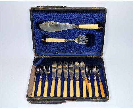 A boxed set of silver collared fish knives and forks by William Yates, engraved decoration with bone handles, Sheffield 1913.