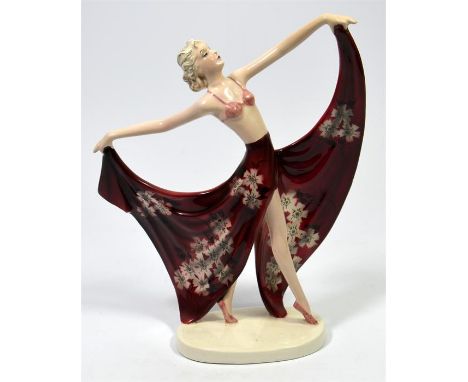A Goldscheider 'Champagne' figure, a dancer in an extravagant skirt, designed by Stefan Dakon and Josef Lorenzl. Model 7826 6