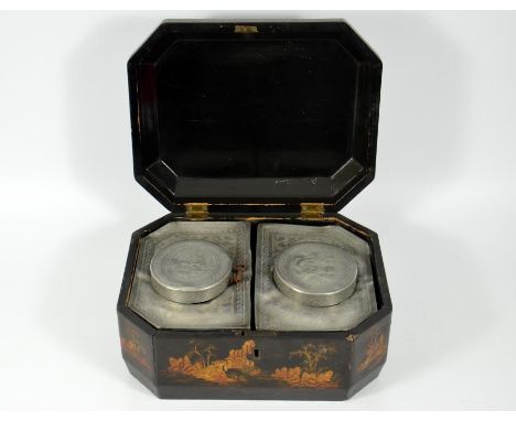 A Chinoiserie tea caddy in a lacquer box, with red embellishments on the outside and engraved pewter caddies inside. Circa 18