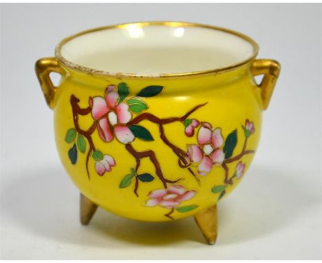 A Royal Worcester cauldron shaped vase, with floral decoration on a yellow ground, circa 1870. Height 11cm.