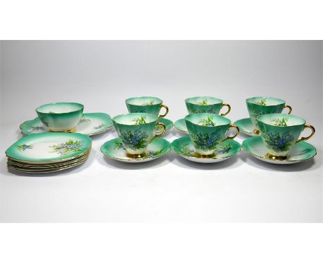 A Windsor, part tea service,,decorated green and white with lily of the valley, 6 cups and saucers, 6 side plates, 1 tea plat