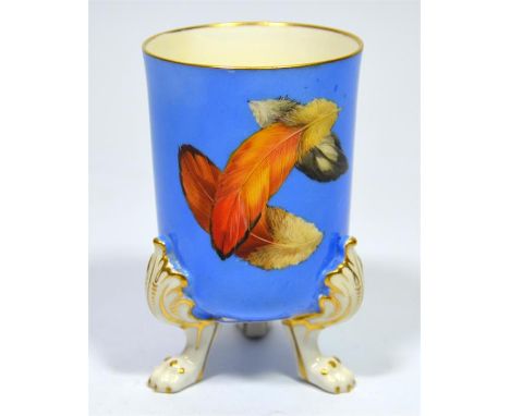A Royal Worcester vase, with feather decoration on a duck egg blue ground and lion paw feet, date code for 1877. Height 11cm.