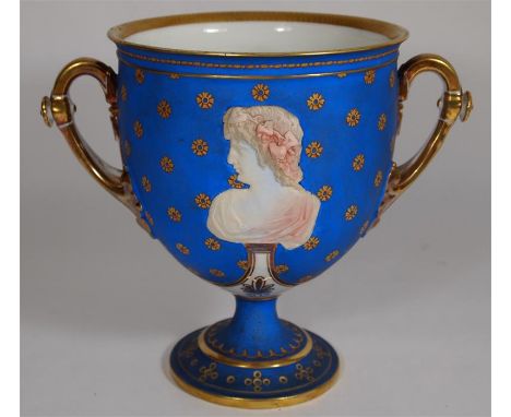 A Paris goblet vase depicting portrait medallions. Circa 1900. Height 21cm.