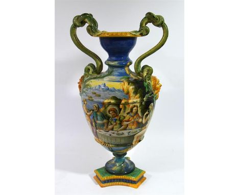 A large maiolica serpent handled floor vase, after Cantagalli, decorated with classical Italian scene, circa 1890. Height 61c