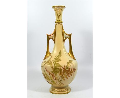 A Royal Worcester twin handled vase, with gilded ferns on a blush ivory ground, date code for 1890. Height 41.5cm.