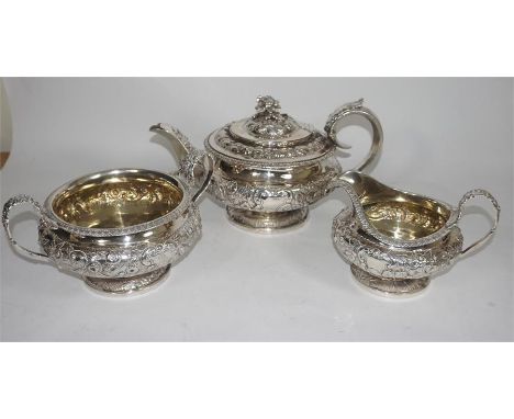 A George IV period silver tea service by Hyam Hyams, London 1824. Comprising teapot, two handled sugar bowl and a cream jug. 