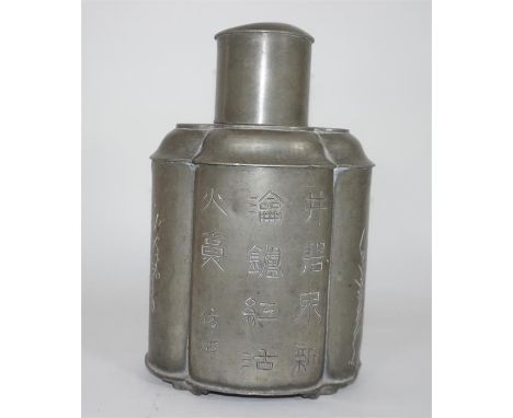 A Chinese pewter tea caddy by Kut Hing Swatow, decorated with Chinese symbols. Early 20th century. Height 20cm.
