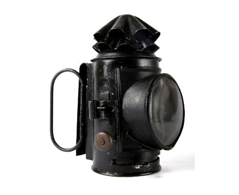 Victorian Royal Irish Constabulary lantern, the black japanned body with two folding handles and belt clip. 6" (15cm) high. P