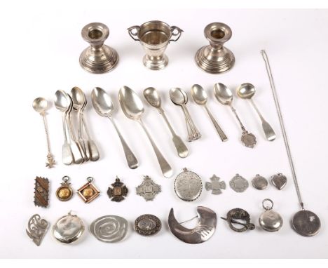 A mixed lot of miscellaneous hallmarked silver, including a miniature trophy cup, a pair of desk candlesticks, various brooch