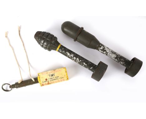 Three prop pieces of World War II American ordnance, a piece of dummy TNT and two inert bazooka rounds. 