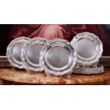 A SET OF TWELVE STERLING SILVER DINNER PLATES BY BENJAMIN SMITH III, LONDON, 1828