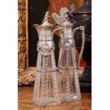A PAIR OF LATE 19TH CENTURY SILVER MOUNTED CUT GLASS CLARET JUGS