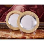 STUART DEVLIN: A PAIR OF STERLING SILVER AND PARCEL GILT MODERNIST PLATES, 1968