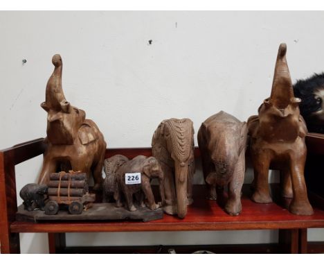 SHELF LOT OF WOODEN CARVED ELEPHANTS 