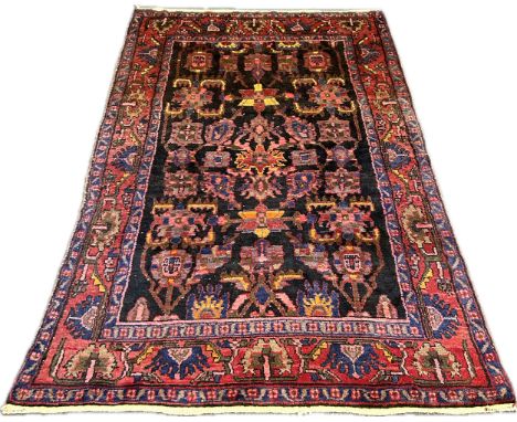 A vintage hand woven rug [208 x 141cm]