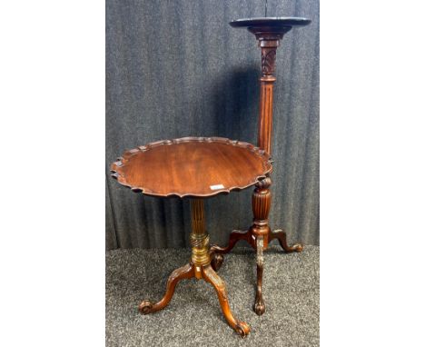 A reproduction mahogany plant stand together with a reproduction mahogany scalloped edged side table both raised on tripod le