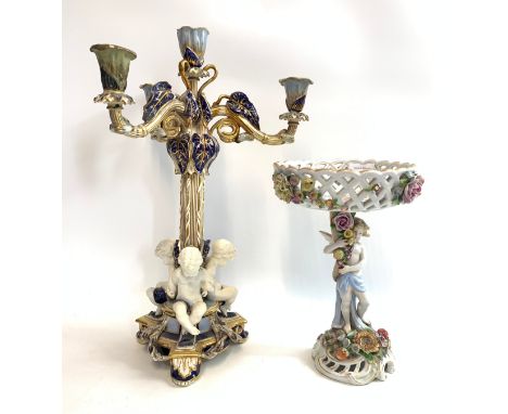 Large porcelain figural candelabra together with Dresden style figural centrepiece comport (Damage to both pieces, please see