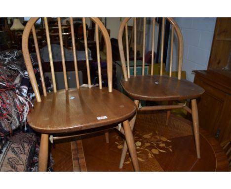 A set of of four beech hoop and stick back kitchen chairs, probably Ercol