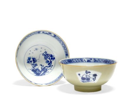 A pair of Chinese porcelain bowls Kangxi  (1662-1722) decorated floral and fan shaped blue and white panels of flowers and fo