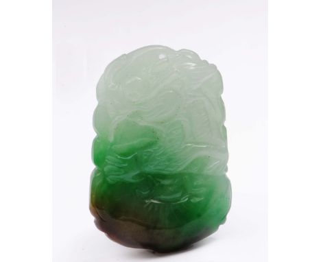 A Chinese emerald green and white jade pendant 19th Century carved as a phoenix