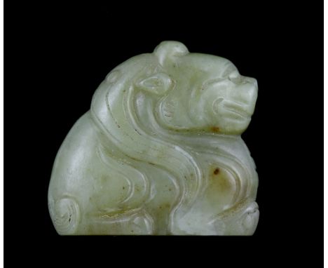 A Chinese yellow jade pendant 18th Century in the form of a mythical beast, in the Tang style, 4.1cm wide