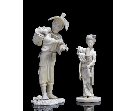 A Japanese sectional ivory okimono Meiji period (1868-1912) carved as a standing farmer gathering peaches, some of which is c