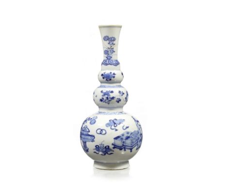 A Chinese blue and white triple gourd bottle vase Kangxi (1662-1722) the main body decorated with scattered antiques, the nec