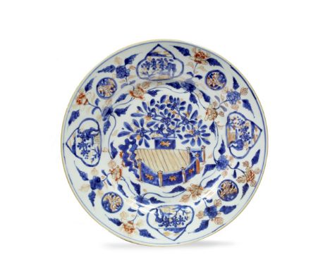 A Chinese Imari charger Kangxi (1662-1722) having underglaze blue fence, flower and panel designs with iron red flowers, 35.5
