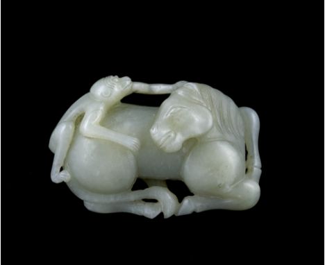 A Chinese white jade carving Ming Dynasty (1368-1644) in the form of a horse looking over its shoulder with a monkey on its b