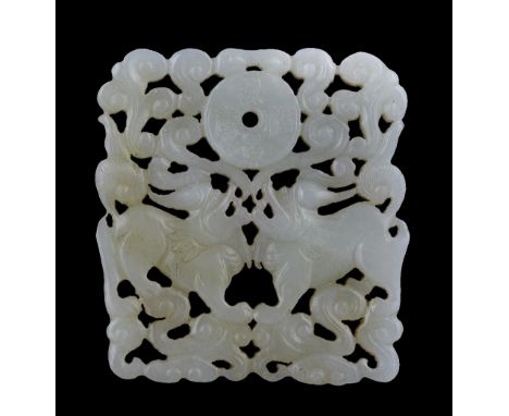 A Chinese white jade pendant 18th Century pierced and carved in the form of two kylins looking up to a bi ring with four char