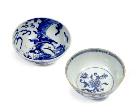 Two Chinese blue and white bowls Kangxi (1662-1722) one decorated with a dragon amongst clouds with mark to underside, the ot