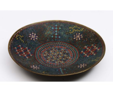 A Japanese Shippo enamel shallow saucer dish early 19th Century with polychrome geometric inlay, 18.5cm